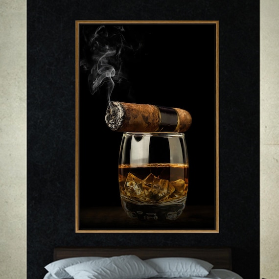 Cigar resting on a whiskey glass in a dark bar
